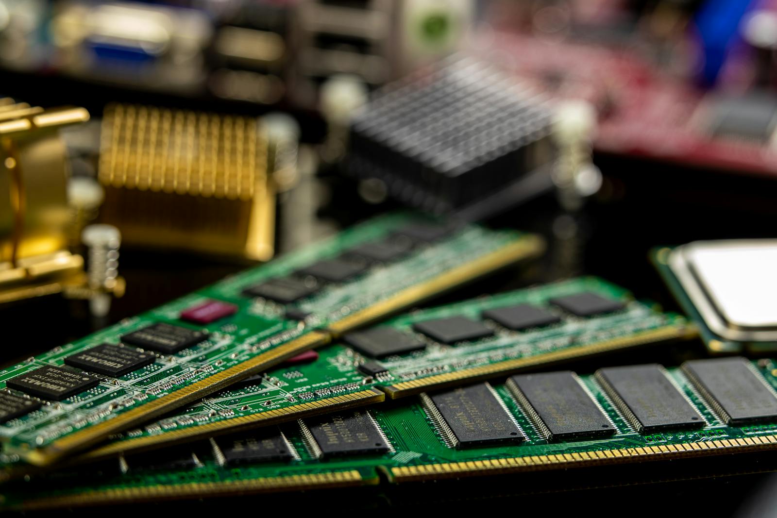 DDR5 DIMM memory modules — green PCB with DRAM packages visible